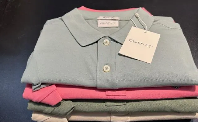 Stapel polo's van GANT in groen, roze en beige